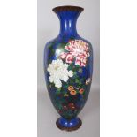 A LARGE JAPANESE MEIJI PERIOD BLUE GROUND CLOISONNE VASE, decorated with peony and other foliage,