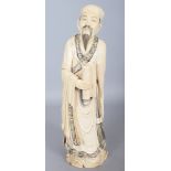 A GOOD LARGE EARLY 20TH CENTURY CHINESE CARVED IVORY FIGURE OF A STANDING SCHOLAR, weighing