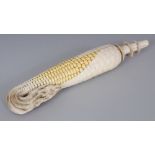 A JAPANESE MEIJI PERIOD STAINED IVORY OKIMONO OF A CORN COB, the details naturalistically