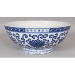 A LARGE GOOD QUALITY CHINESE MING STYLE BLUE & WHITE PORCELAIN BOWL, decorated with formal scrolling