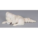 A GOOD QUALITY JAPANESE MEIJI PERIOD IVORY CARVING OF A CHIN DOG, the Pekingese type animal