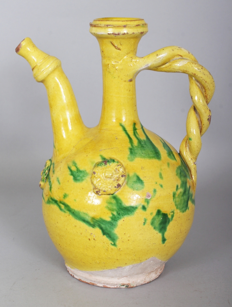 A GOOD 19TH CENTURY OTTOMAN CHANNAKALE GLAZED POTTERY EWER, decorated with splashes of green on a