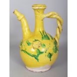 A GOOD 19TH CENTURY OTTOMAN CHANNAKALE GLAZED POTTERY EWER, decorated with splashes of green on a