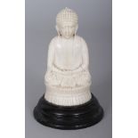 AN EARLY 20TH CENTURY JAPANESE MEIJI PERIOD CARVED IVORY FIGURE OF BUDDHA, together with a fixed