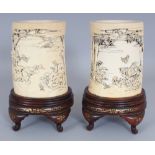 A PAIR OF FINE QUALITY SIGNED JAPANESE MEIJI PERIOD IVORY TUSK VASES, mounted on fitted lacquered