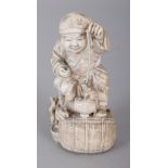 A GOOD QUALITY SIGNED JAPANESE MEIJI PERIOD IVORY OKIMONO OF DAIKOKU, seated on his bale and