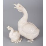 A JAPANESE MEIJI PERIOD IVORY OKIMONO OF A GOOSE & ITS GOSLING, the details naturalistically carved,