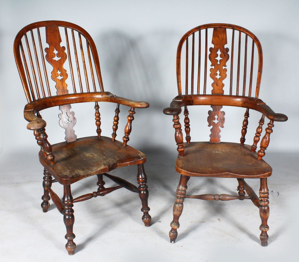 A VERY NEAR SET OF SIX YEW WOOD TALL BACK BROAD ARMCHAIRS. (Two Illustrated).