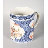 A CANTON PORCELAIN MUG, depicting figures in an interior. 5.5ins high.