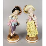 A PAIR OF CONTINENTAL PORCELAIN FIGURES OF A YOUNG GALLANT AND YOUNG GIRL, large feathers in their