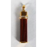 A CARTIER GOLD AND WOOD PENDANT.