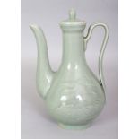 AN EARLY 20TH CENTURY JAPANESE CELADON PORCELAIN EWER & COVER, 8.3in high overall.
