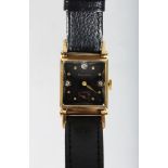 A LADIES 14K GOLD BULOVA WRISTWATCH with leather strap, in a fitted case.