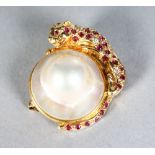 A 14CT GOLD AND LARGE PEARL RUBY SET BROOCH.