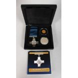 A REPLICA SILVER GEORGE CROSS MEDAL, two crowns, in a presentation case.