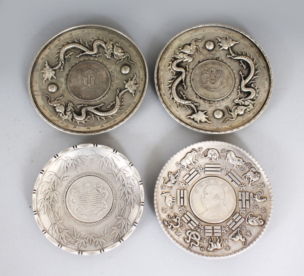 A PAIR OF CHINESE COIN DISHES; together with two further similar examples. Largest 4ins diameter.