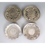 A PAIR OF CHINESE COIN DISHES; together with two further similar examples. Largest 4ins diameter.