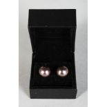 A PAIR OF BLACK PEARL EARRINGS.