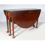 A GEORGE III MAHOGANY OVAL DROP FLAP GATE-LEG DINING TABLE on pad feet. 4ft 9ins long with flaps