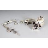 A SILVER SKULL AND CHAIN.