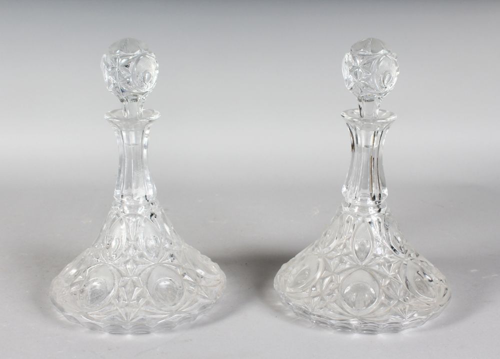 A PAIR OF SHIPS DECANTERS AND STOPPERS.