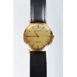 A GENTLEMAN'S GOLD BULOVA WRISTWATCH with leather strap, in a fitted case.