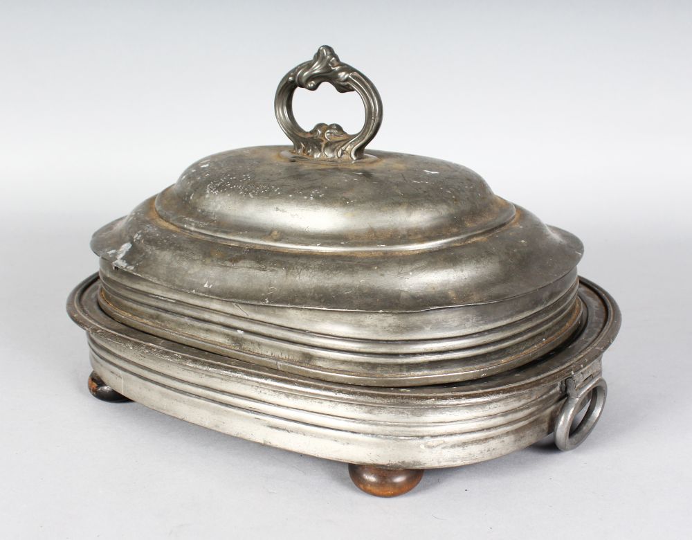 A 19TH CENTURY OVAL PEWTER WARMING DISH AND COVER, James Dixon & Sons. 14ins wide.