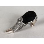 A SILVER NOVELTY BOOT PIN CUSHION.