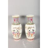 A PAIR IF 20TH CENTURY CHINESE REPUBLICAN PORCELAIN VASES, depicting figures in a landscape and with