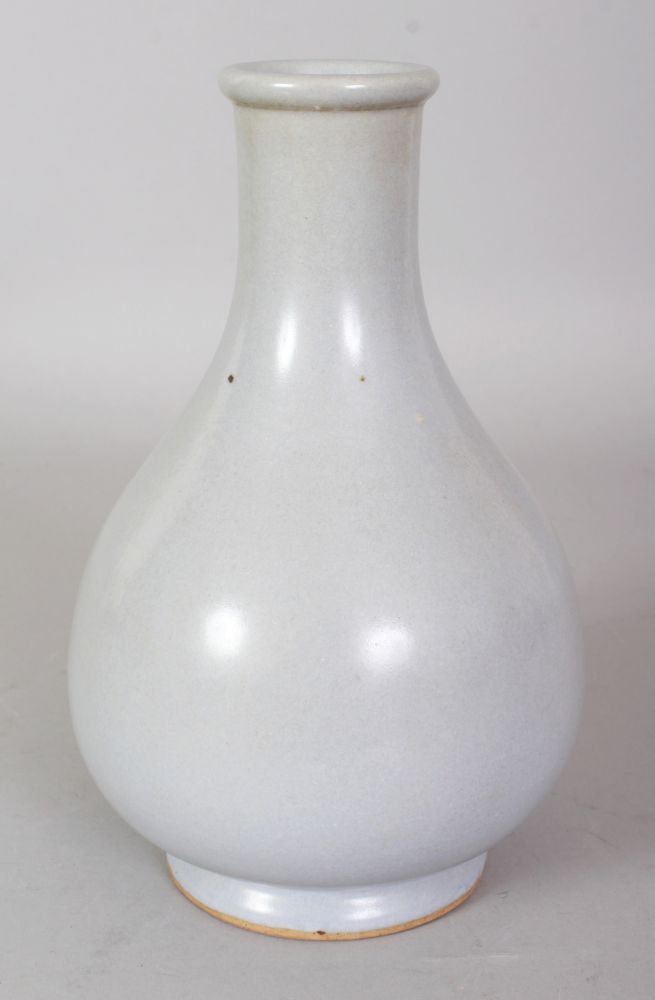 A CHINESE JUN STYLE PORCELAIN BOTTLE VASE, applied with a pale blue-green glaze, 8in high. - Image 2 of 4