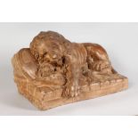 A GOOD ANTIQUE CARVED STONE GROUP, THE WOUNDED LION, designed by Bertel Thorvaldsen. 15ins long x