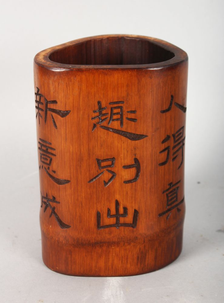 A CHINESE CARVED CALLIGRAPHY BAMBOO BRUSH POT. 6ins high.