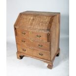 AN 18TH CENTURY OAK BUREAU, with fall front, fitted interior over three long drawers with brass