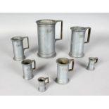 A SET OF SEVEN CONTINENTAL PEWTER MEASURES. 7ins high and smaller.