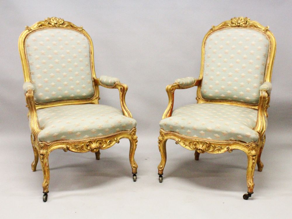 A GOOD PAIR OF 19TH CENTURY FRENCH CARVED AND GILDED FAUTEUIL, upholstered in a pale green classical
