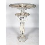 AN 18TH CENTURY LEAD FOUNTAIN, a cupid holding two circular dishes. 2ft high.