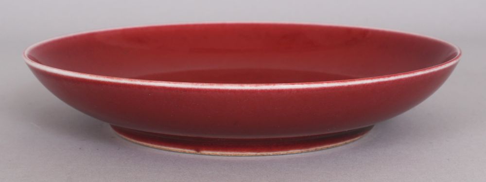 A CHINESE COPPER RED PORCELAIN SAUCER DISH, the base with a six-character Yongzheng mark, 6.9in - Image 2 of 4