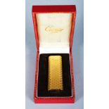 A GOLD PLATED CASED CARTIER FLORGALVA LIGHTER.