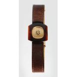 A VERY UNUSUAL BOUCHERON OF PARIS 1920'S GOLD AND ONYX WRISTWATCH, No. B3633, with leather strap, in
