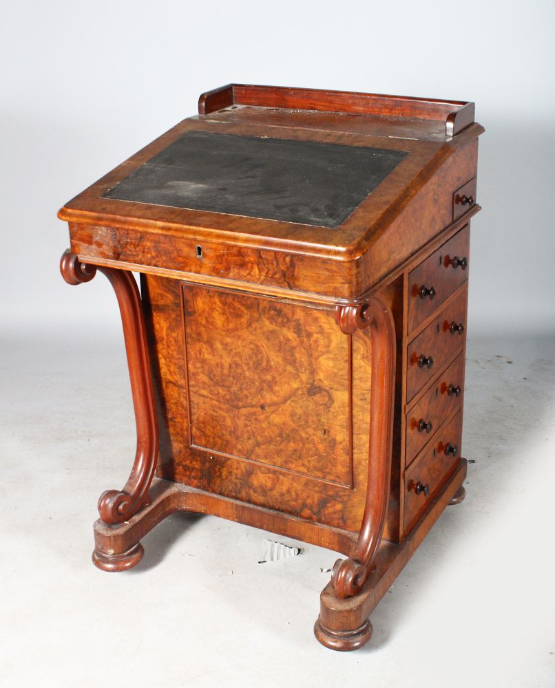 A VICTORIAN WALNUT DAVENPORT, with folding flap, satinwood interior, with four drawers to the