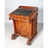 A VICTORIAN WALNUT DAVENPORT, with folding flap, satinwood interior, with four drawers to the