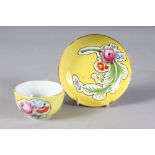 A MEISSEN CUP AND SAUCER, yellow ground painted with flowers. Cross swords mark in blue.