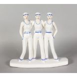 AN ART DECO STYLE POTTERY GROUP OF THREE SAILOR GIRLS. 11ins high.