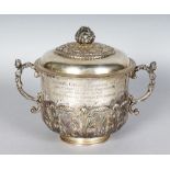 A GOOD VICTORIAN CIRCULAR TWO-HANDLED PORRINGER AND COVER, with caryatid figure handle and supported