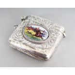 AN ENGRAVED SILVER VESTA CASE, Birmingham 1904, with an oval of a hunting scene.