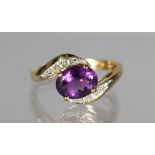 AN 18CT GOLD, AMETHYST AND DIAMOND RING.