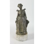 HUGO TAGLANG (b. 1874) AUSTRALIAN BRETON GIRL. Bronze with dark green patina. 15ins high, on