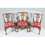 A SET OF EIGHT CHIPPENDALE STYLE MAHOGANY DINING CHAIRS, six single and two carvers, with pierced