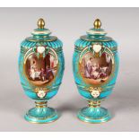 A VERY GOOD PAIR OF SEVRES BLUE VASES AND COVERS, painted with reverse panels of a landscape scene