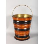 A DUTCH WOODEN BUCKET with brass liner and handle.